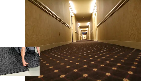 long hotel hallway with patterned carpet